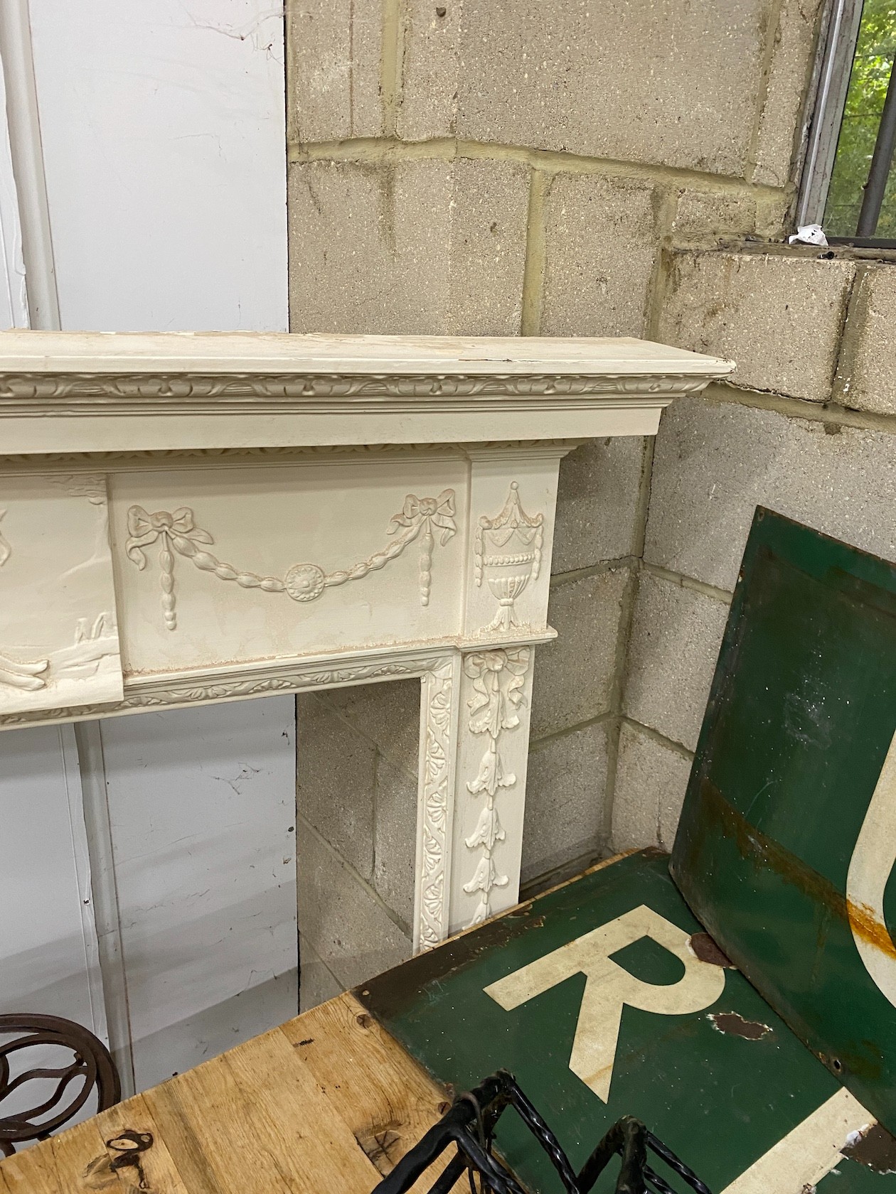 A George III style painted pine and composition fire surround with classical frieze, width 144cm, depth 17cm, height 143cm